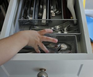 putting spoons away